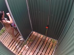 Young Woman Goes To Shower After Swimming In Public Pool