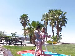 Wet and lubed up babes share dick outdoors on sunny day